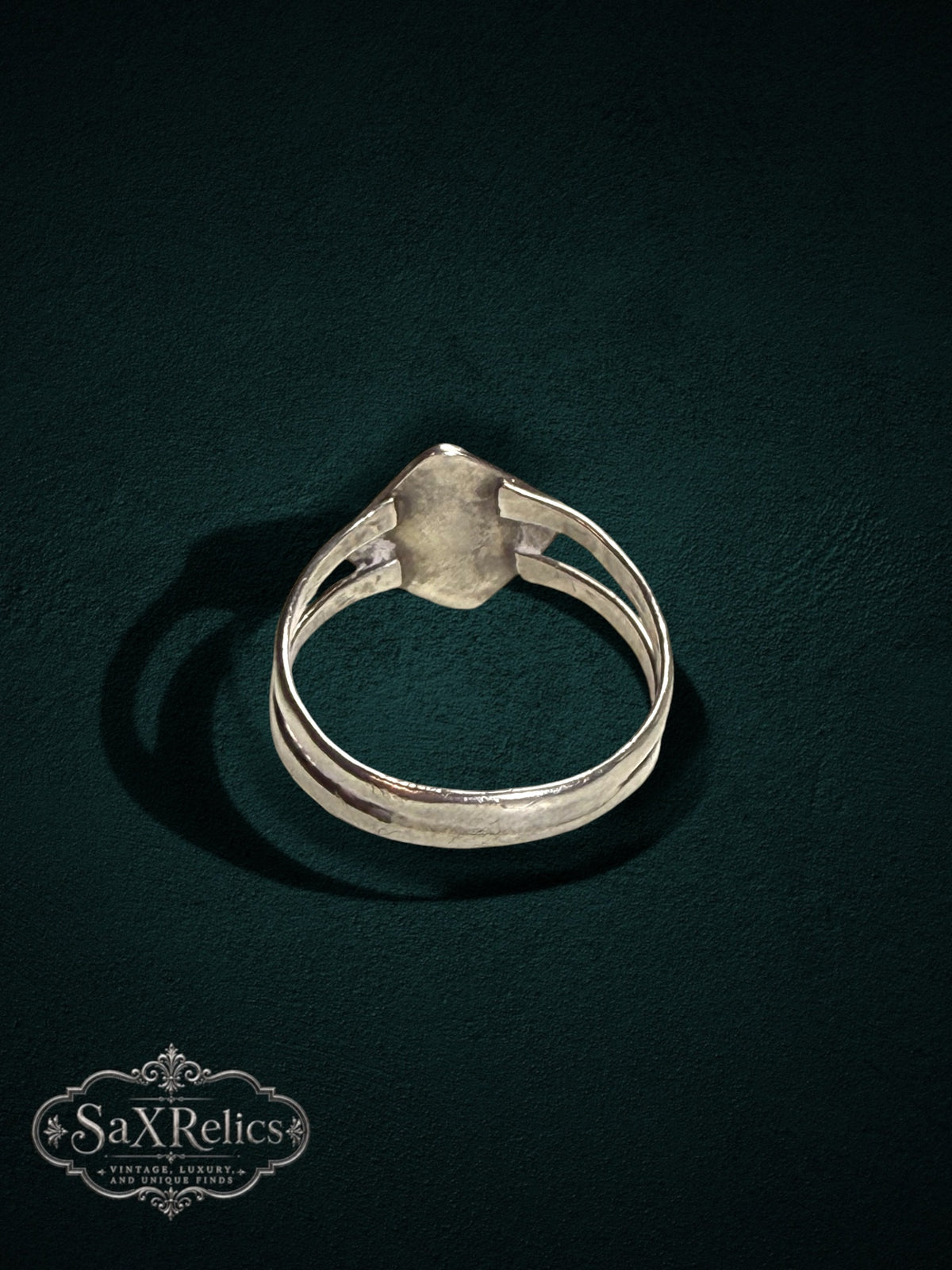 My Store SAXRelics sterling silver geometric statement ring with a split-shank band on a dark textured background