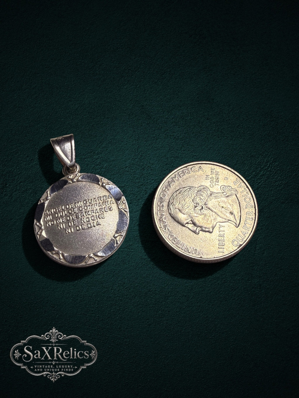 Custodio sterling silver Guardian Angel medallion next to a US quarter for size