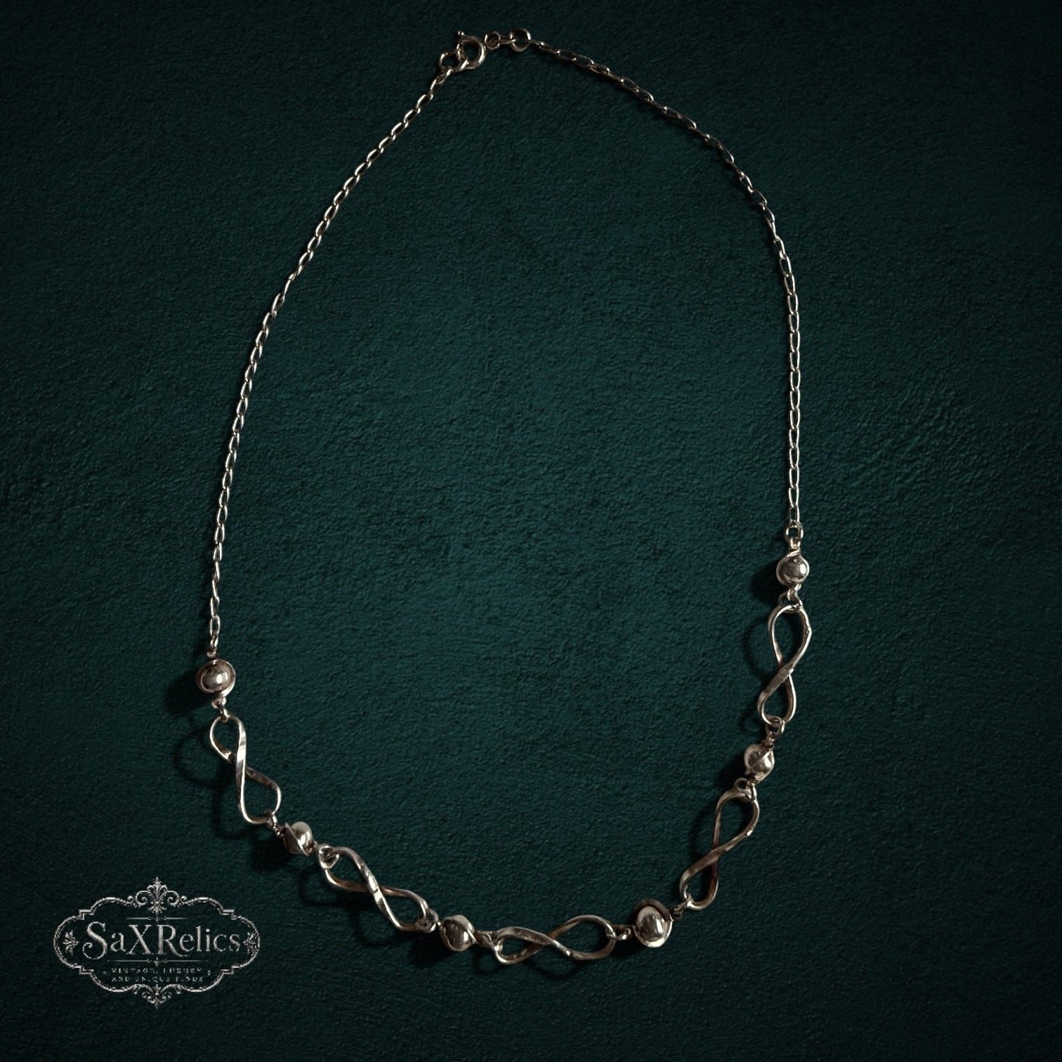 SaX Relics — Infinito Mexican sterling silver necklace alternating infinity links with polished beads.