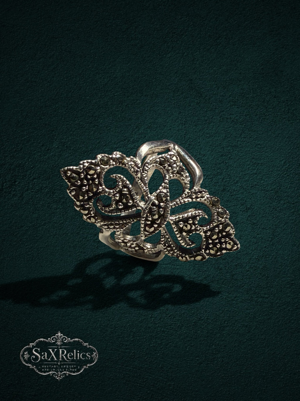 My Store SaxRelics sterling silver statement ring featuring ornate filigree metalwork and shimmering marcasite stones.