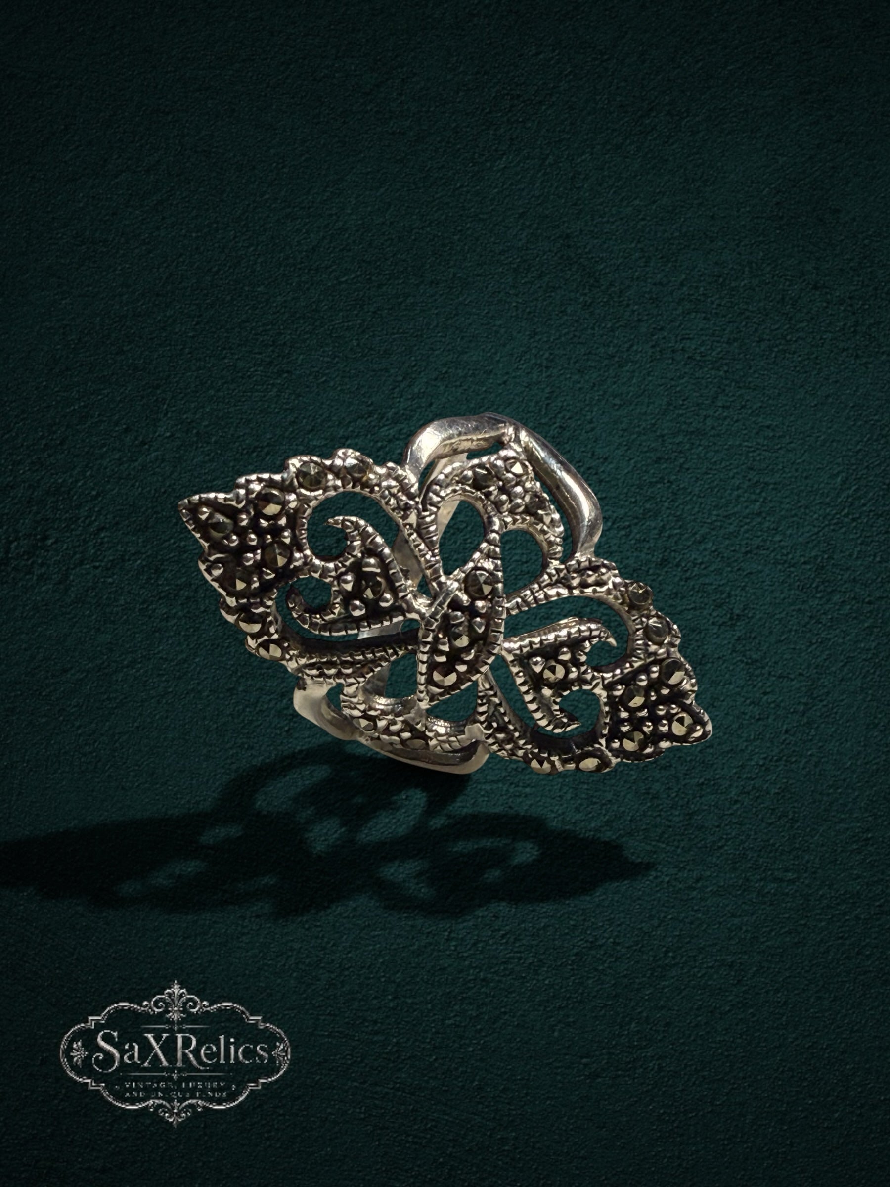 My Store SaxRelics sterling silver statement ring featuring ornate filigree metalwork and shimmering marcasite stones.