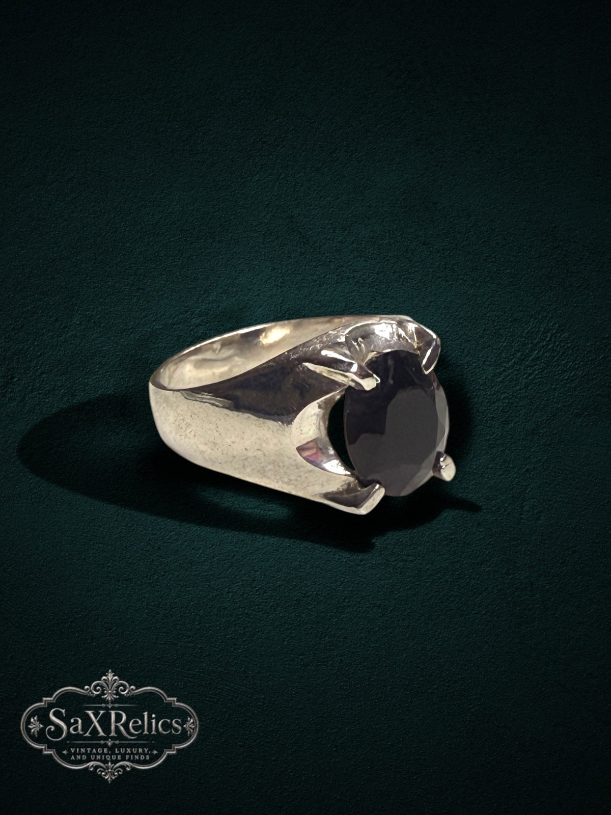 My Store SAXRelics sterling silver statement ring with a dark oval gemstone in a four-prong setting