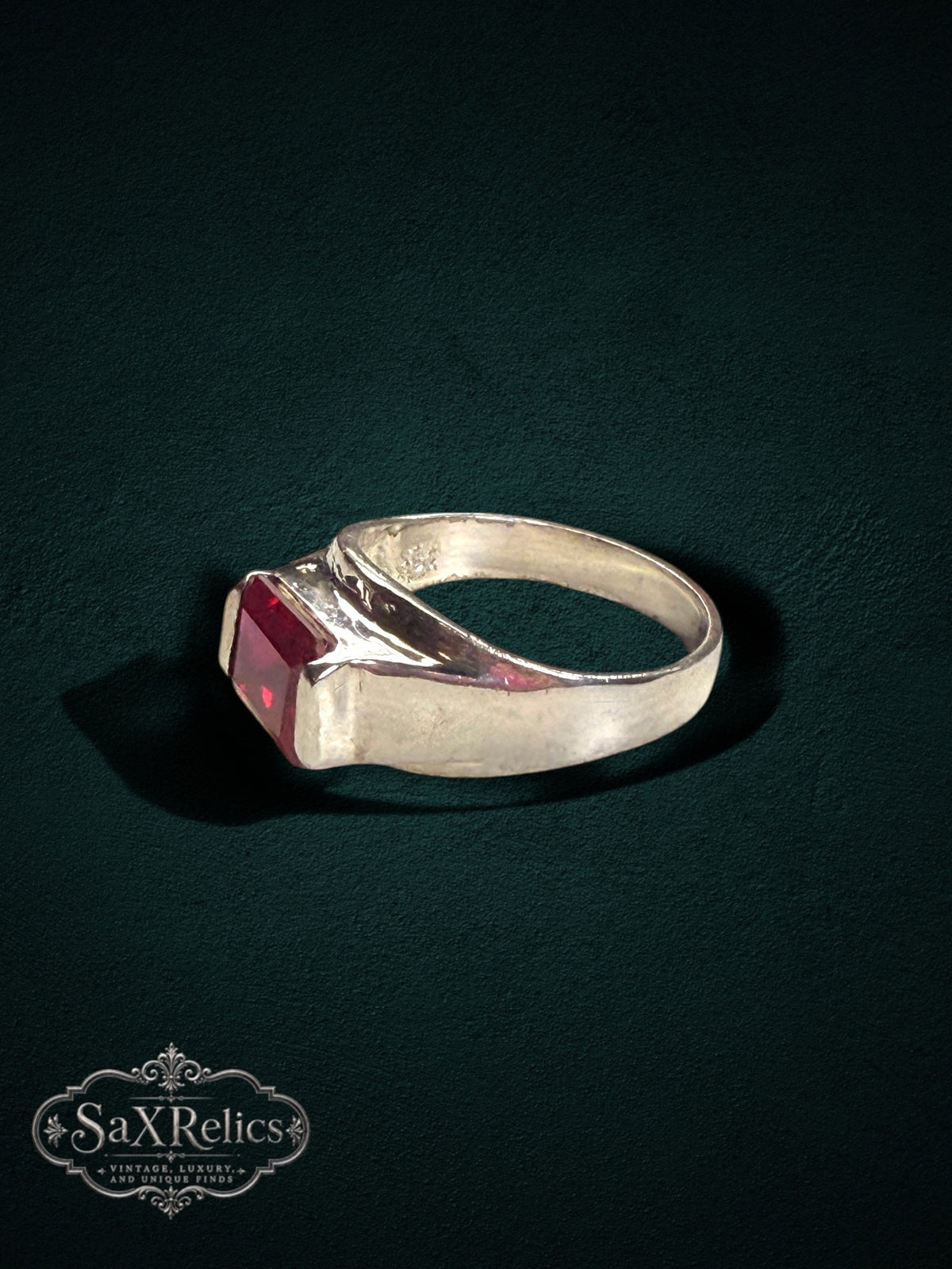 My Store sterling silver statement ring featuring a bold rectangular-cut red gemstone on a polished band