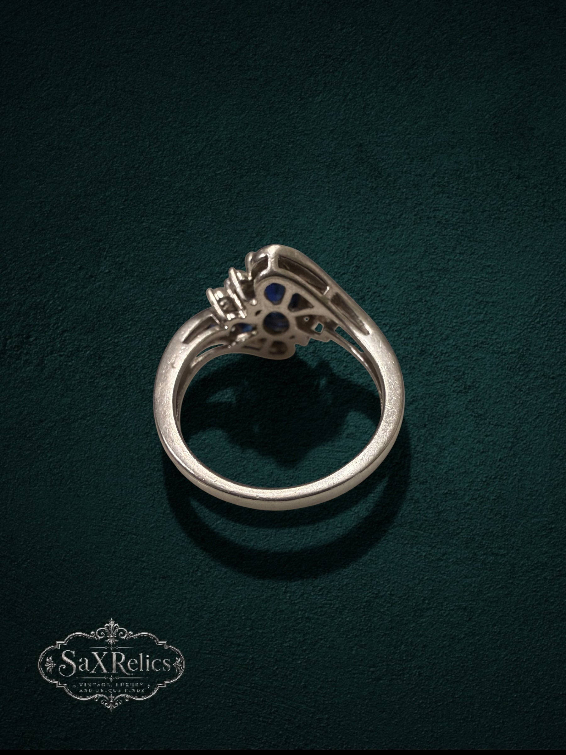 My Store sterling silver statement ring with blue stones and clear crystals, shown from a side profile view.