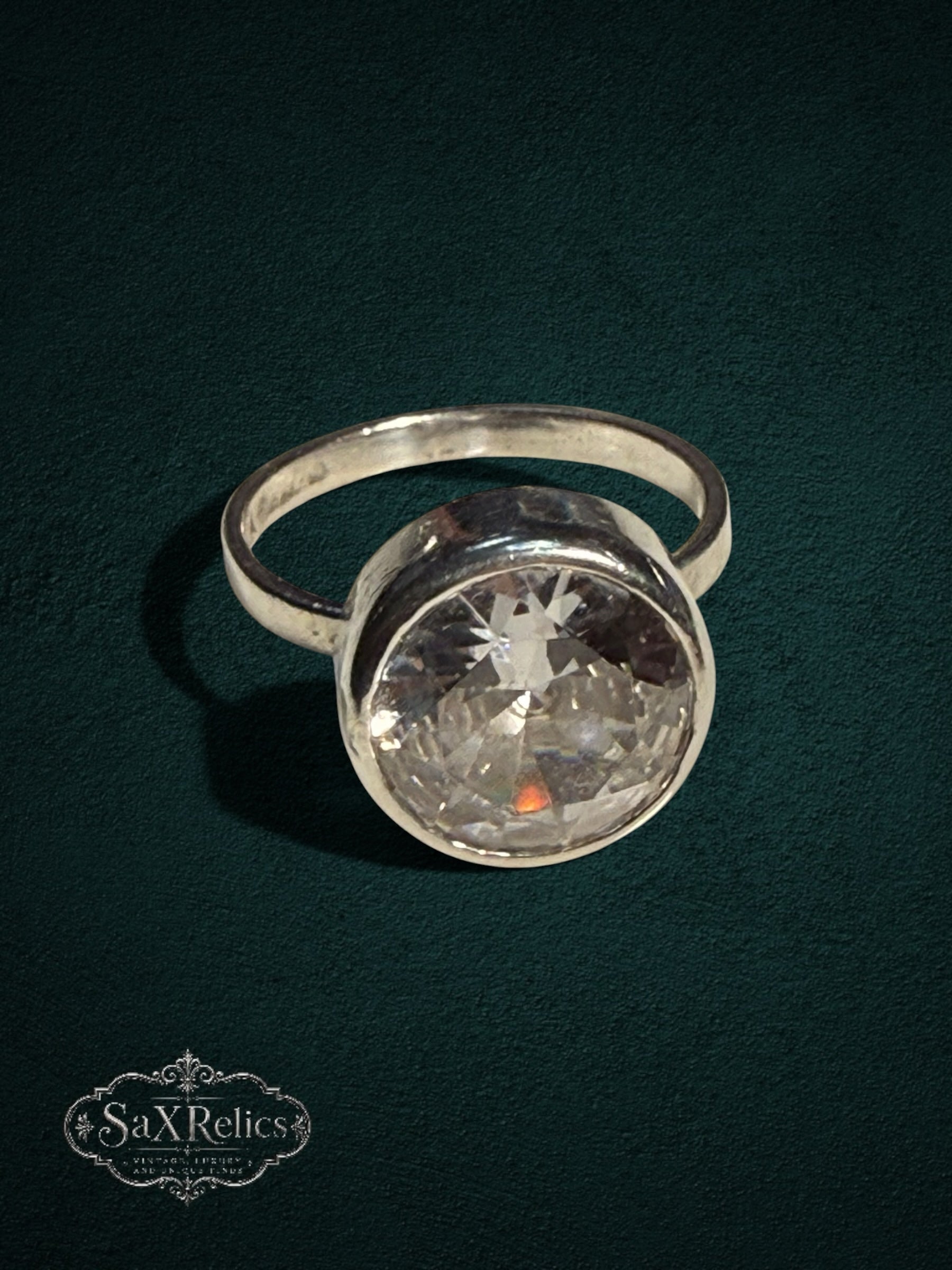 My Store SAXRelics sterling silver statement ring featuring a large brilliant-cut clear stone in a bezel setting.