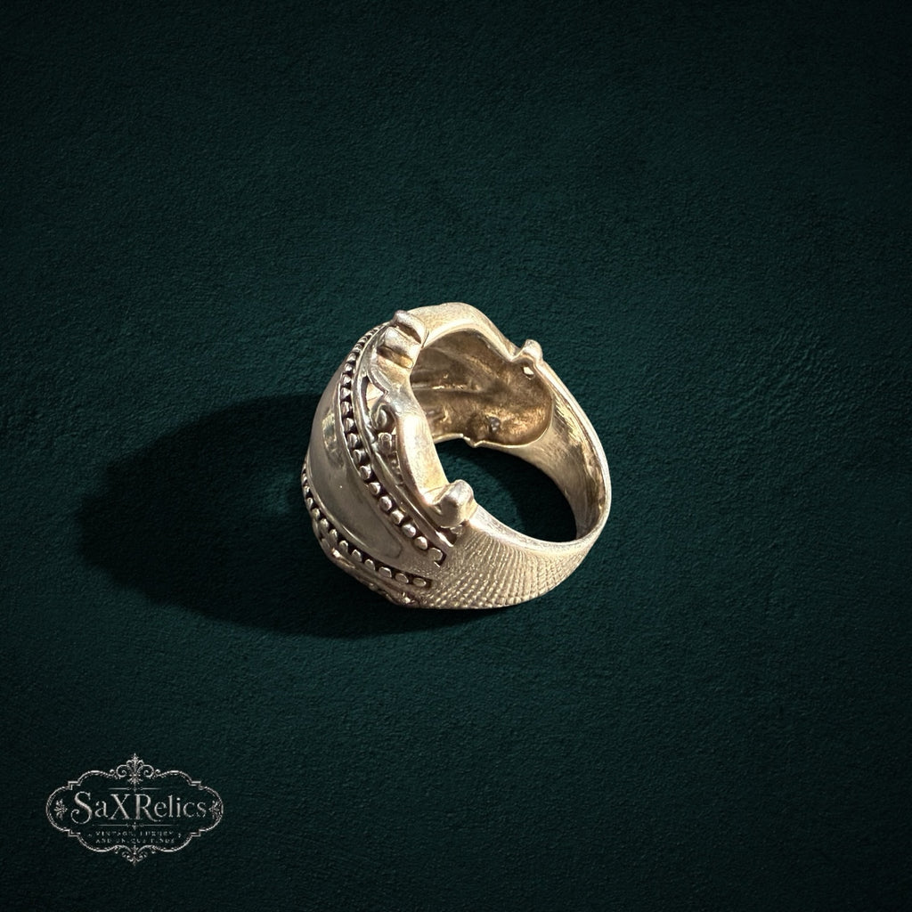My Store SAXRelics sterling silver statement ring with beaded borders, scrollwork, and a textured cross-hatch band.