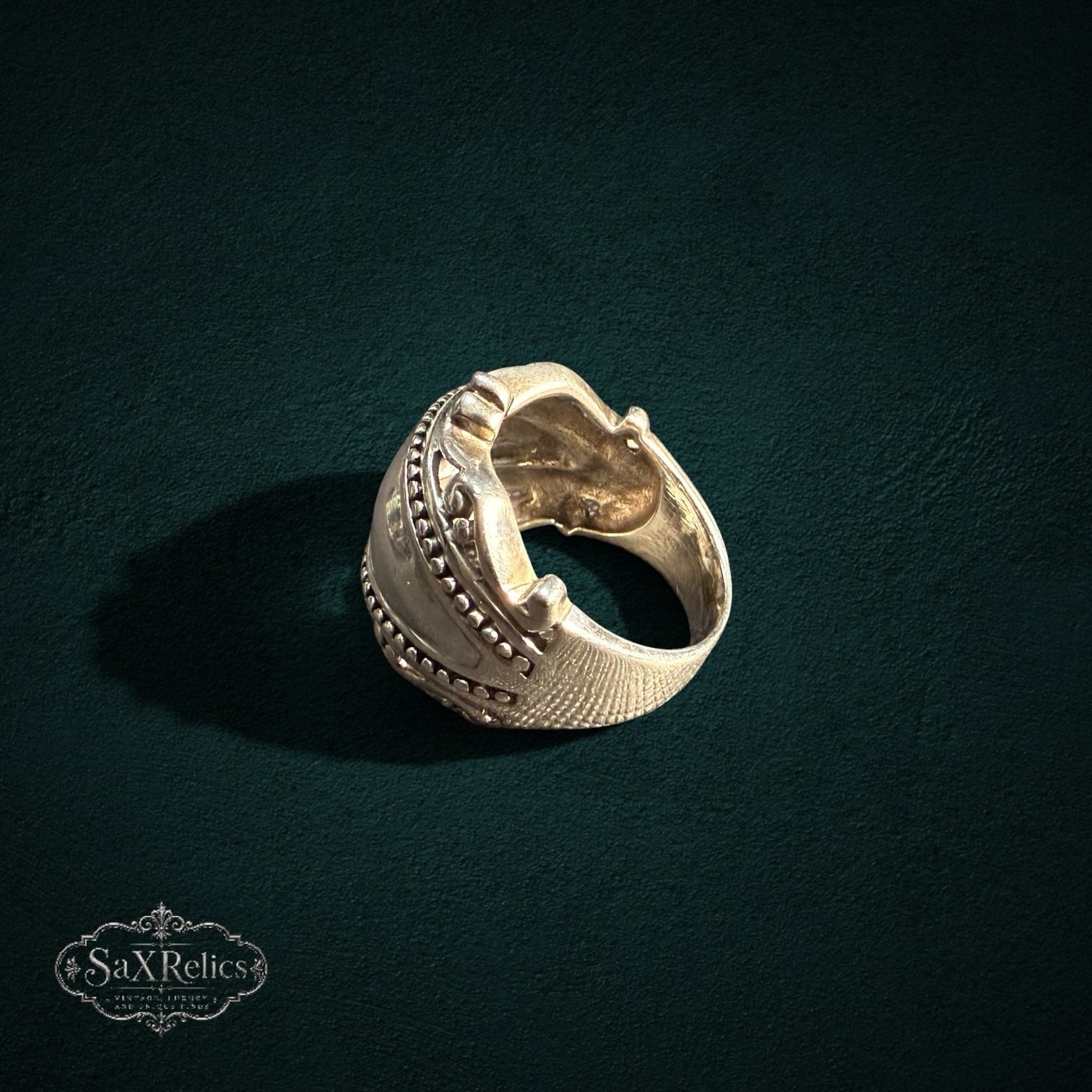 My Store SAXRelics sterling silver statement ring with beaded borders, scrollwork, and a textured cross-hatch band.
