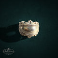 My Store SAXRelics sterling silver statement ring featuring a polished dome, beaded borders, and ornate scrollwork.
