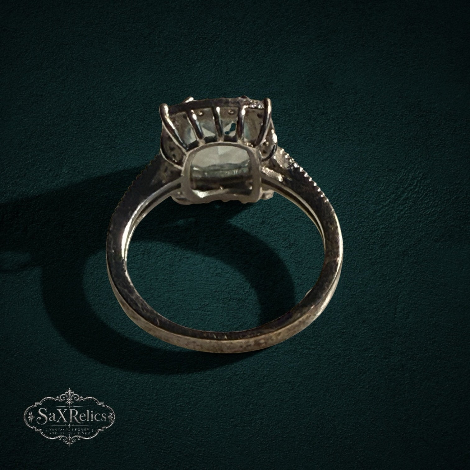 My Store SAXRelics sterling silver statement ring with a cushion-cut stone and intricate beaded band detailing.