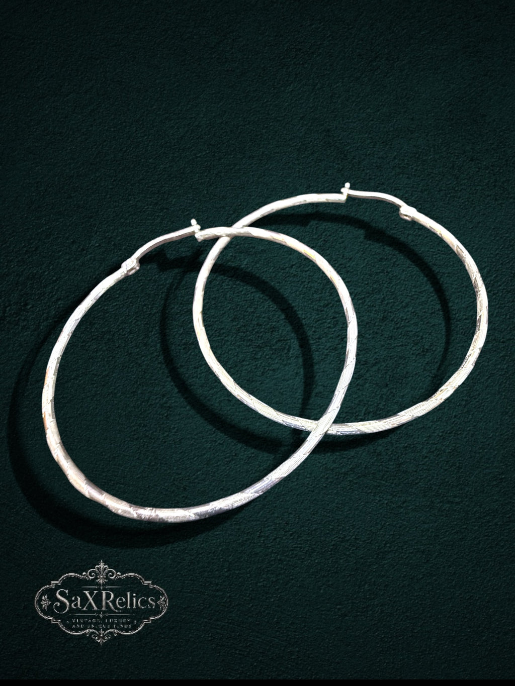 My Store large sterling silver hoop earrings with a subtle textured finish and secure hinged closure