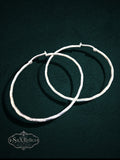 My Store large sterling silver hoop earrings with a subtle textured finish and secure hinged closure