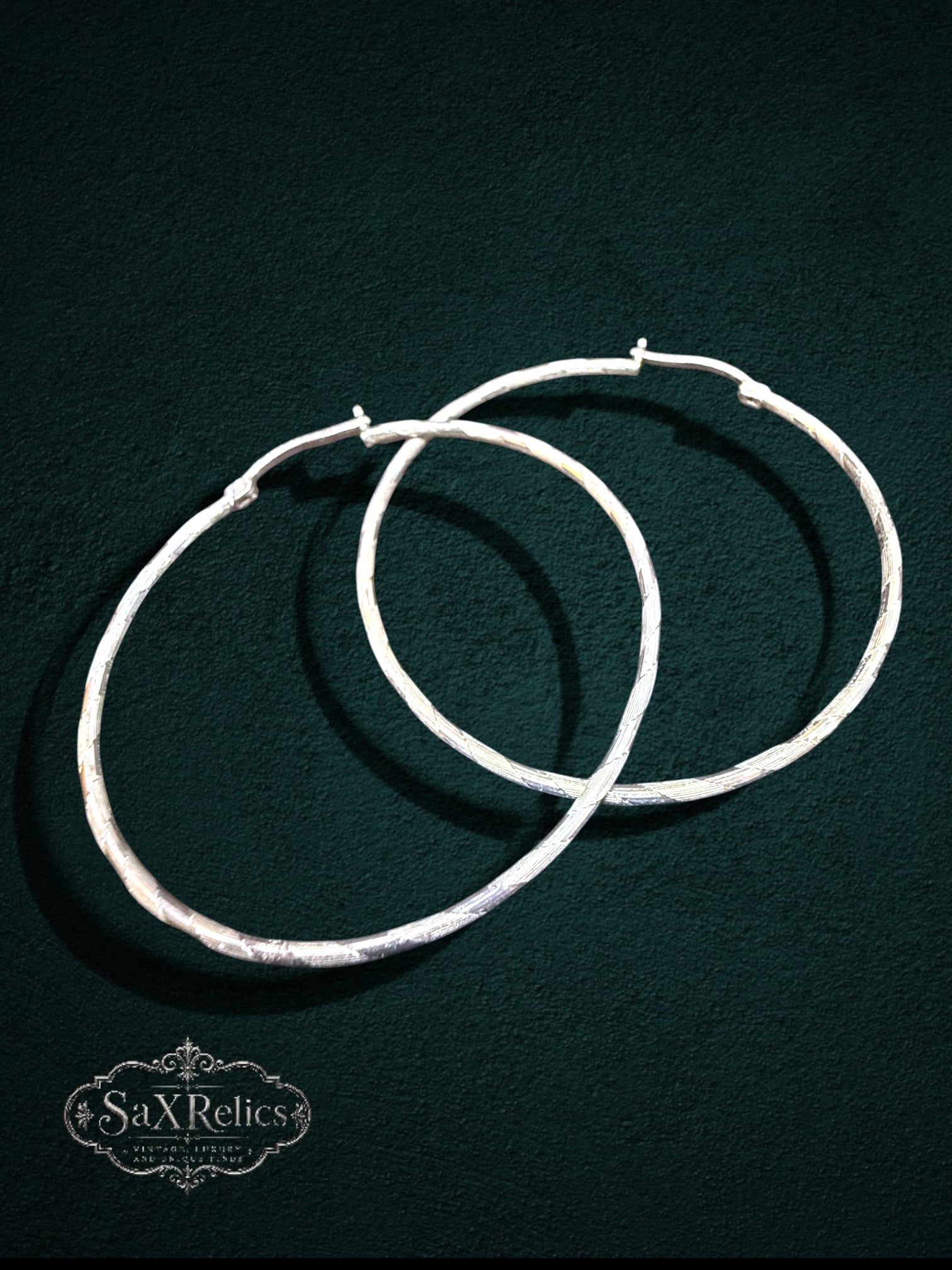 My Store large sterling silver hoop earrings with a subtle textured finish and secure hinged closure