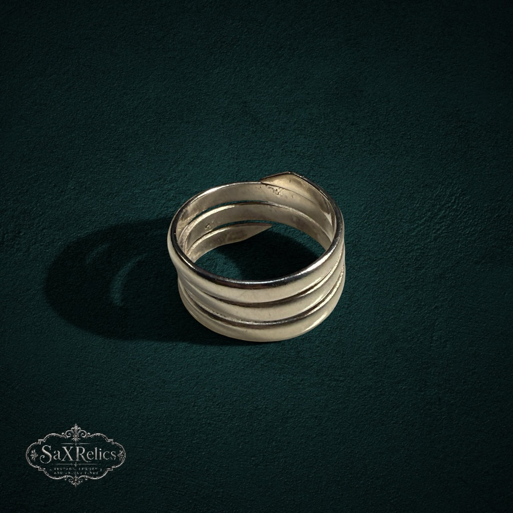 My Store SAXRelics multi-layered sterling silver wrap ring with a polished, sculptural coil design.