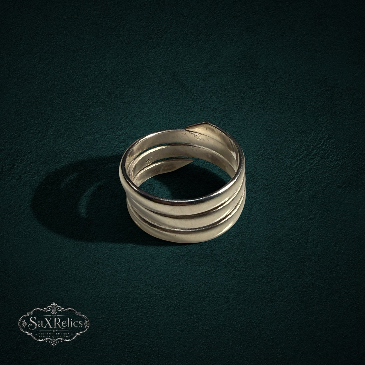 My Store SAXRelics multi-layered sterling silver wrap ring with a polished, sculptural coil design.