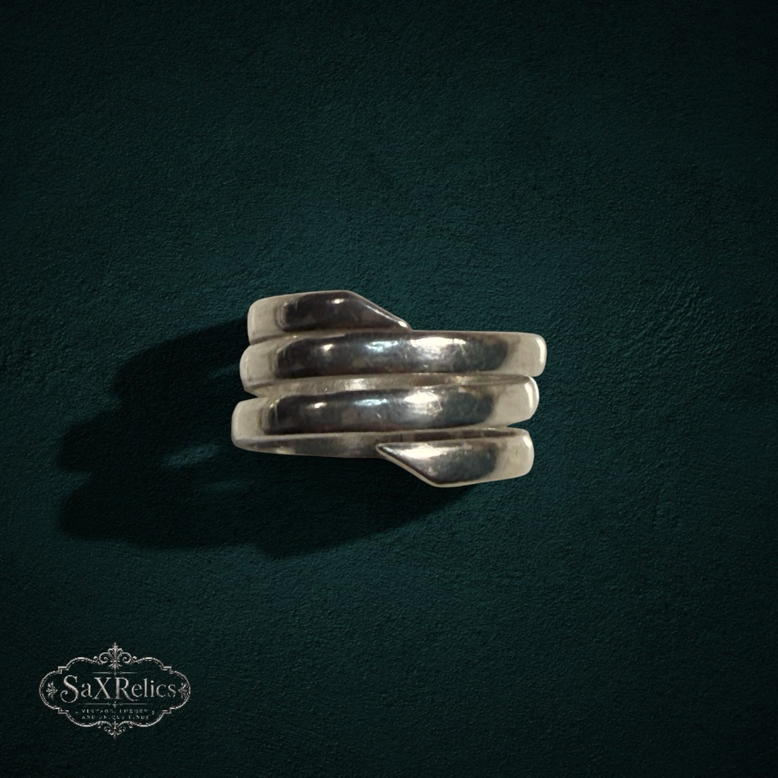 My Store SAXRelics sterling silver multi-layered wrap ring with a polished, sculptural coil design.