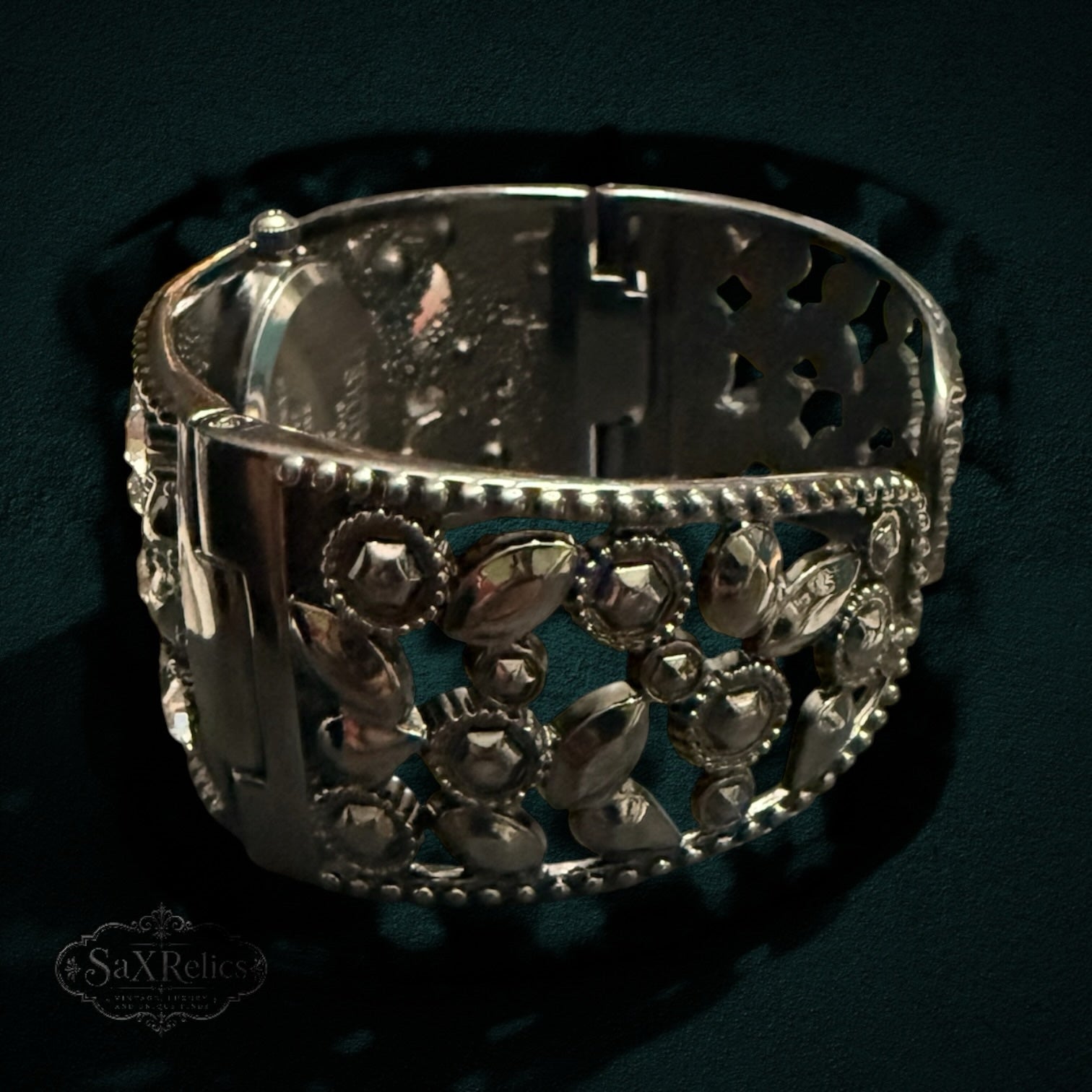 My Store STUDIO cuff bracelet watch in gunmetal tone with intricate open-work metal design and sparkling crystals.
