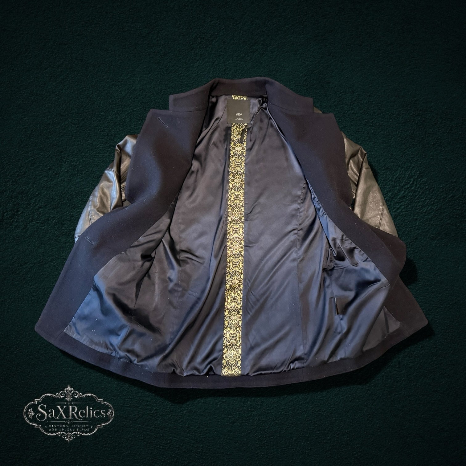 My Store VEDA black wool and leather sleeve jacket with an intricate gold brocade interior lining.
