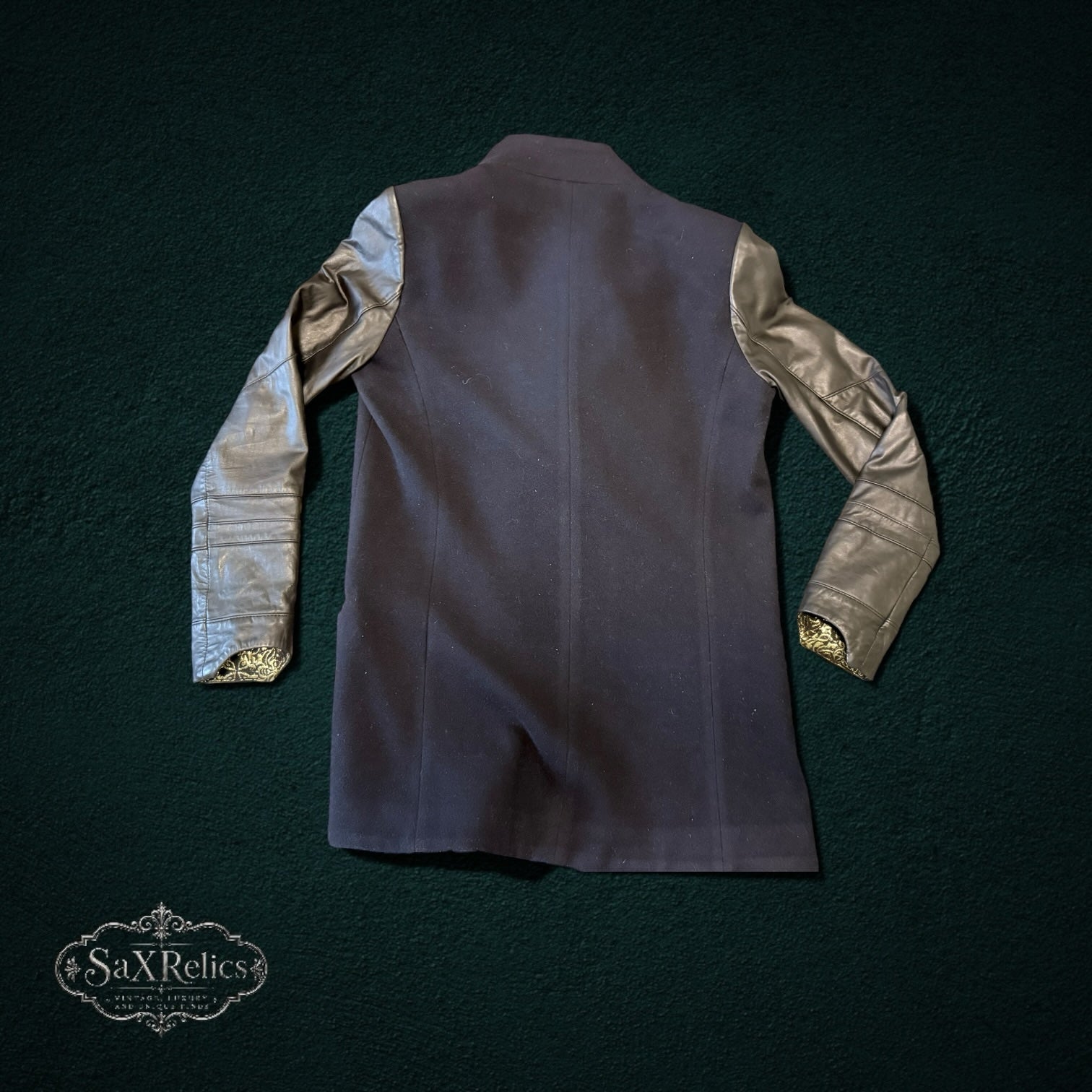 My Store VEDA wool jacket with black sheep leather sleeves and gold brocade lining, back view.