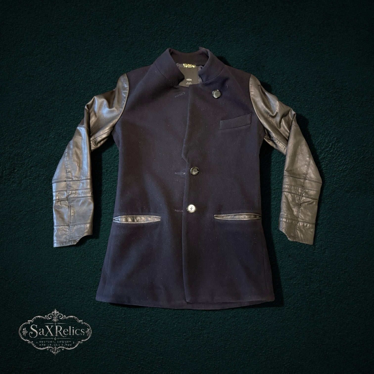 My Store VEDA black wool jacket with contrasting sheep leather sleeves, button-front closure, and pocket detailing.