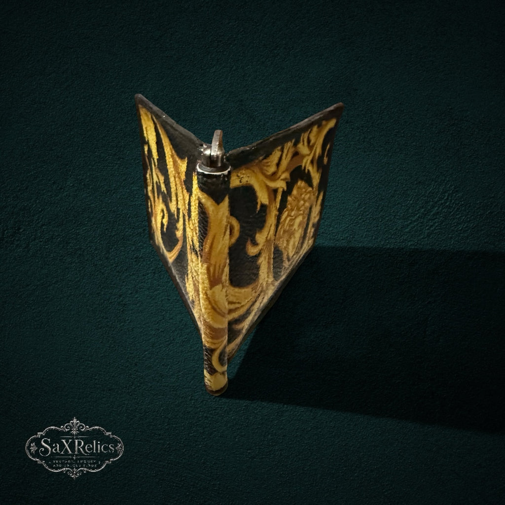 My Store Versace leather money clip wallet featuring a black and gold baroque print with a Medusa head emblem.
