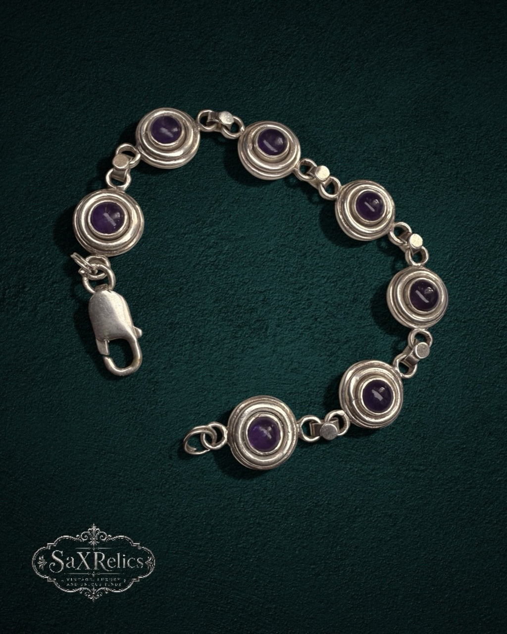 My Store SAXRelics vintage sterling silver bracelet featuring deep purple amethyst cabochons in circular bezel settings.