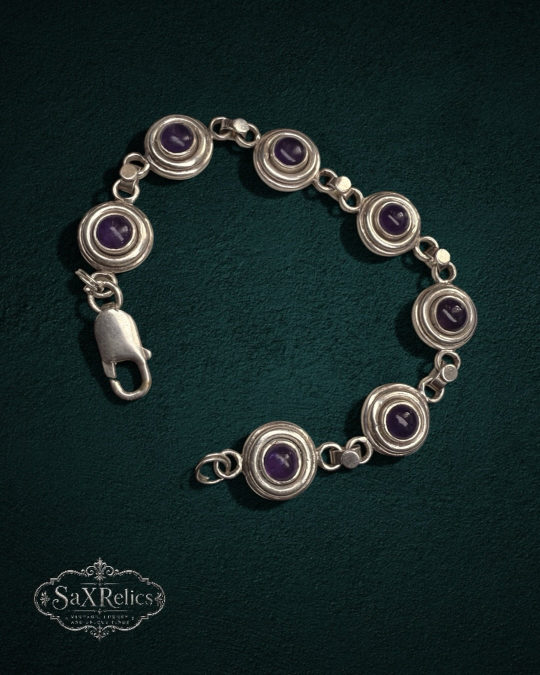 My Store SAXRelics vintage sterling silver bracelet featuring deep purple amethyst cabochons in circular bezel settings.
