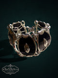 Vintage statement link bracelet with black enamel panels and polished silver-tone architectural metal frames.