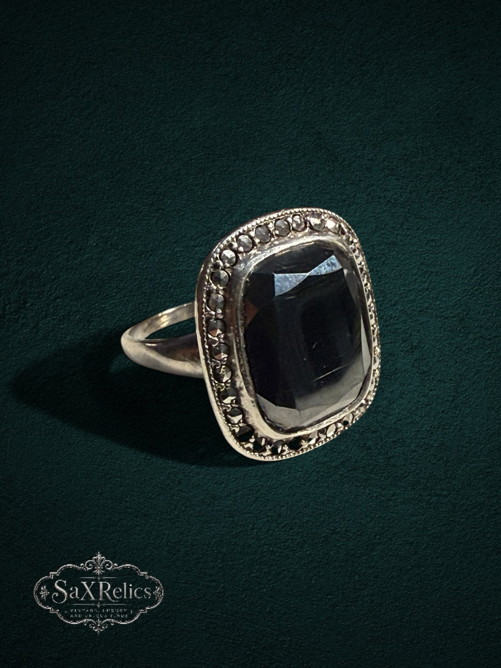 My Store SAXRelics vintage style silver statement ring featuring a large faceted black stone and marcasite accents.