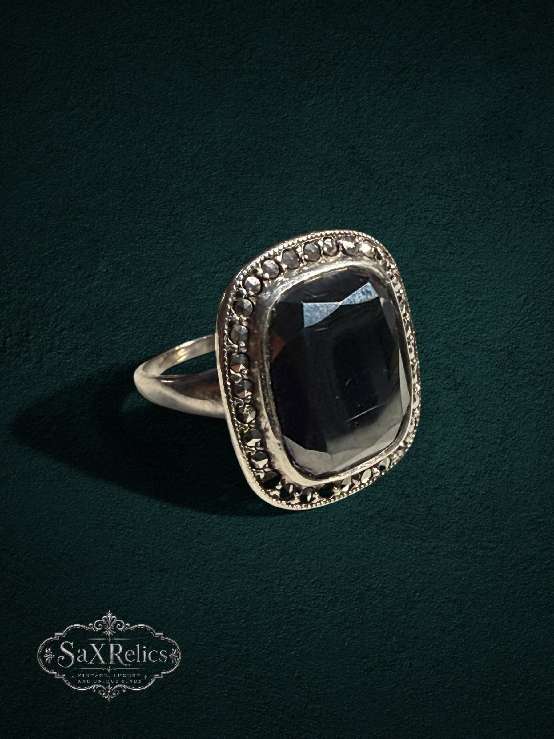My Store SAXRelics vintage style silver statement ring featuring a large faceted black stone and marcasite accents.