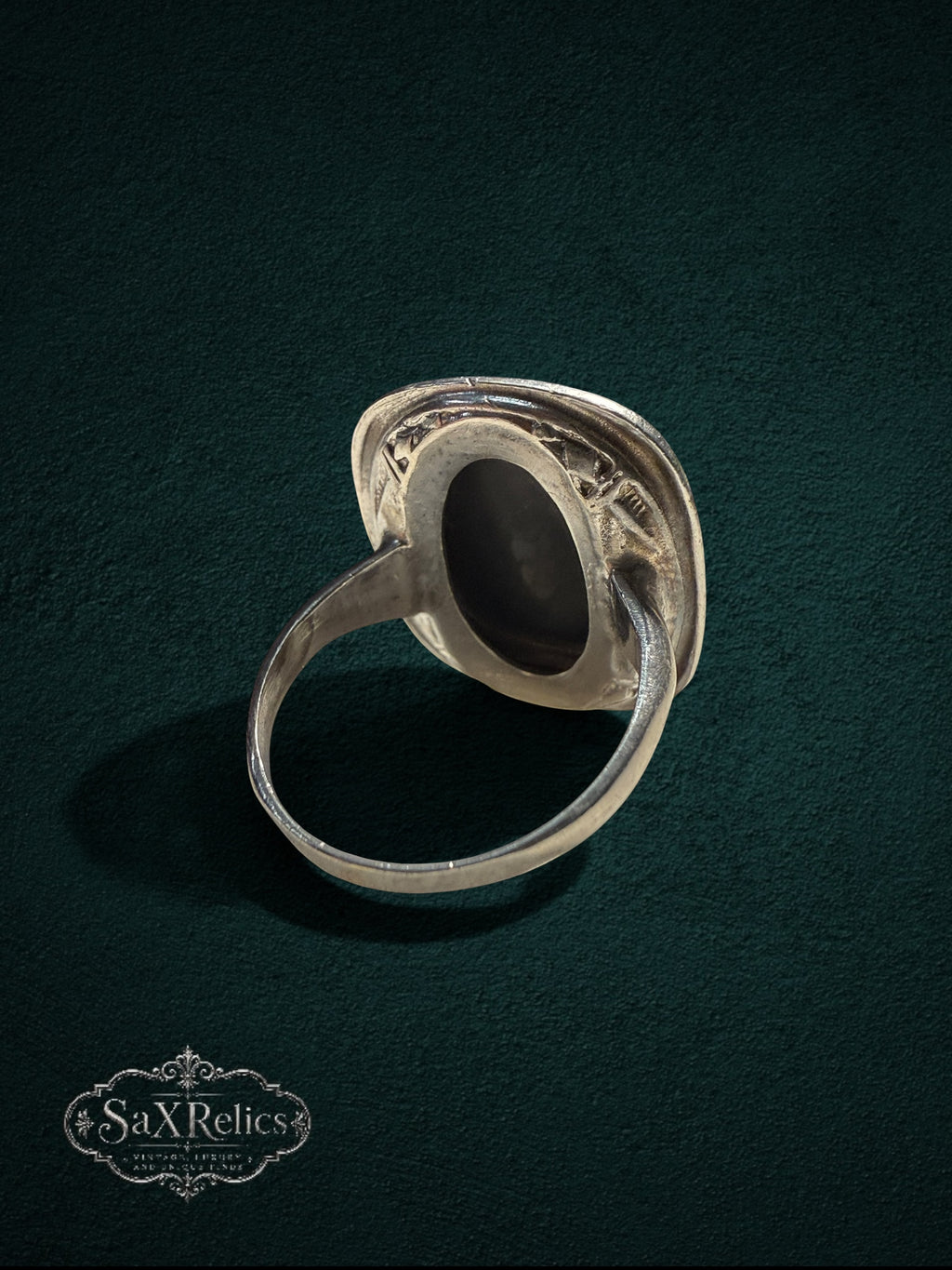 My Store vintage style statement ring with a black stone and silver-tone setting, viewed from the back.