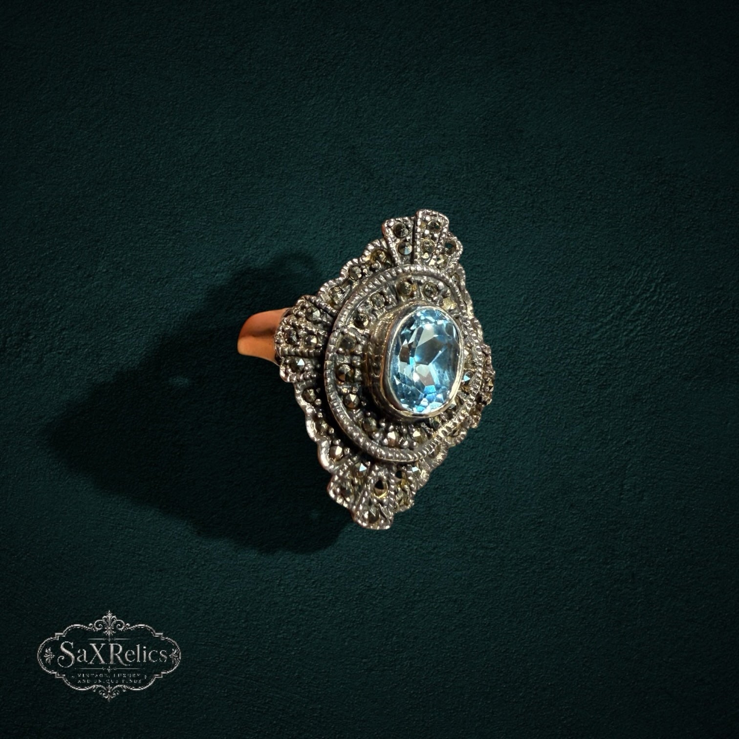 My Store vintage-style sterling silver statement ring featuring an oval light blue stone and ornate marcasite accents.