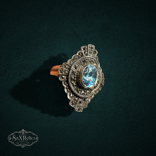 My Store vintage-style sterling silver statement ring featuring an oval light blue stone and ornate marcasite accents.