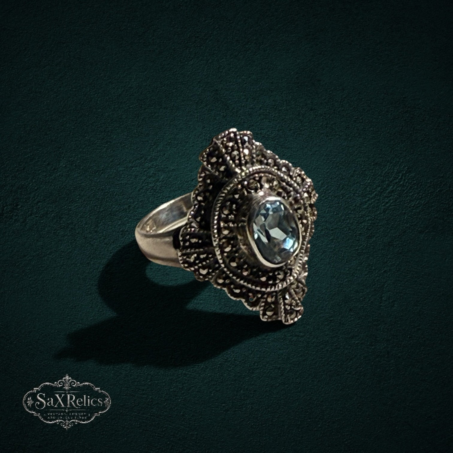 My Store vintage style sterling silver statement ring with an oval light blue stone and ornate marcasite detailing.