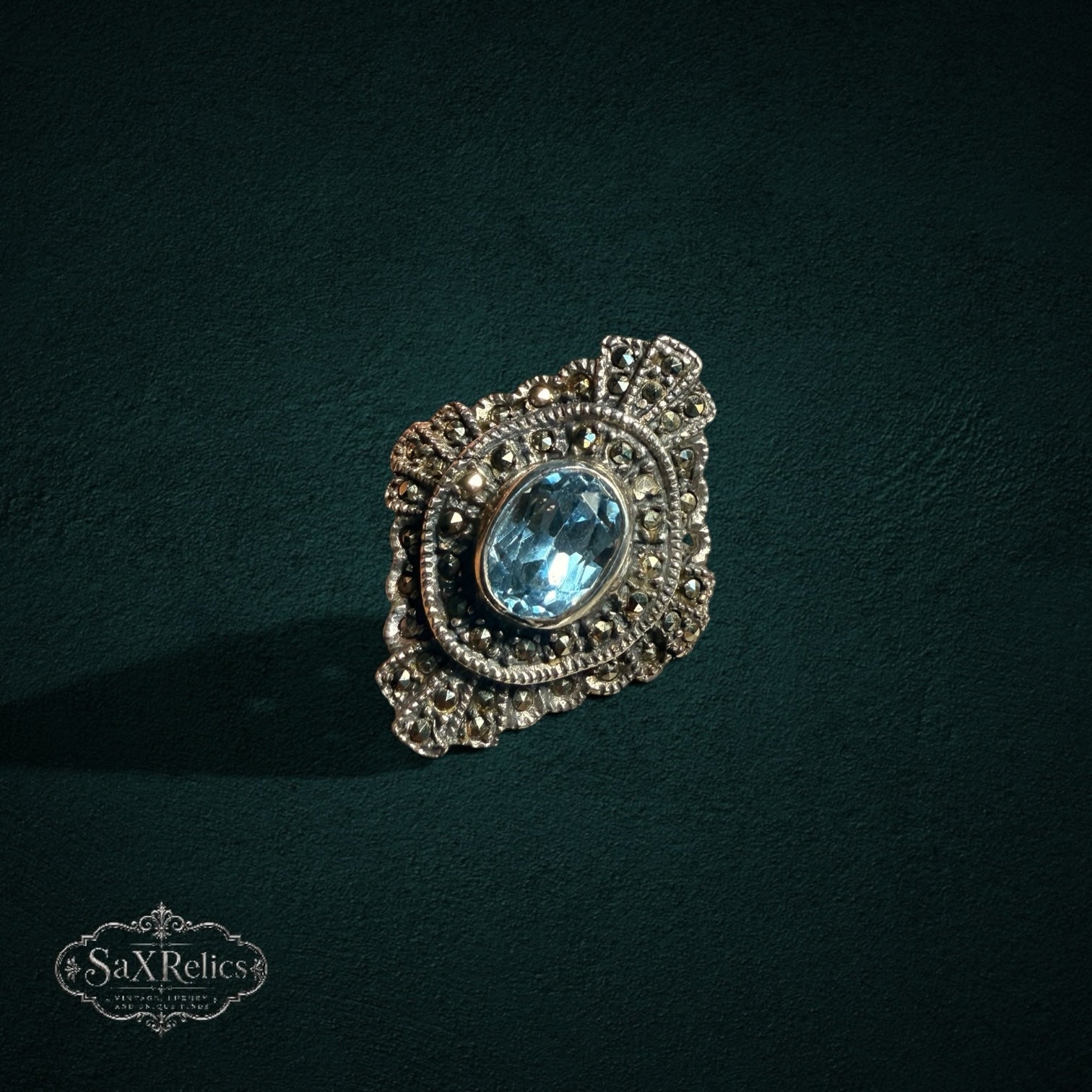 My Store vintage style sterling silver statement ring with an oval light blue stone and ornate marcasite accents.