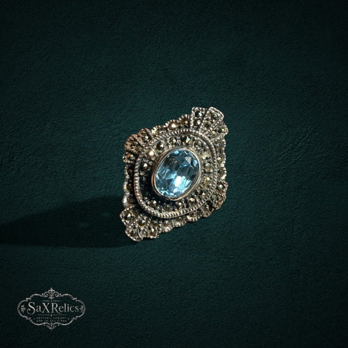 My Store vintage style sterling silver statement ring with an oval light blue stone and ornate marcasite accents.