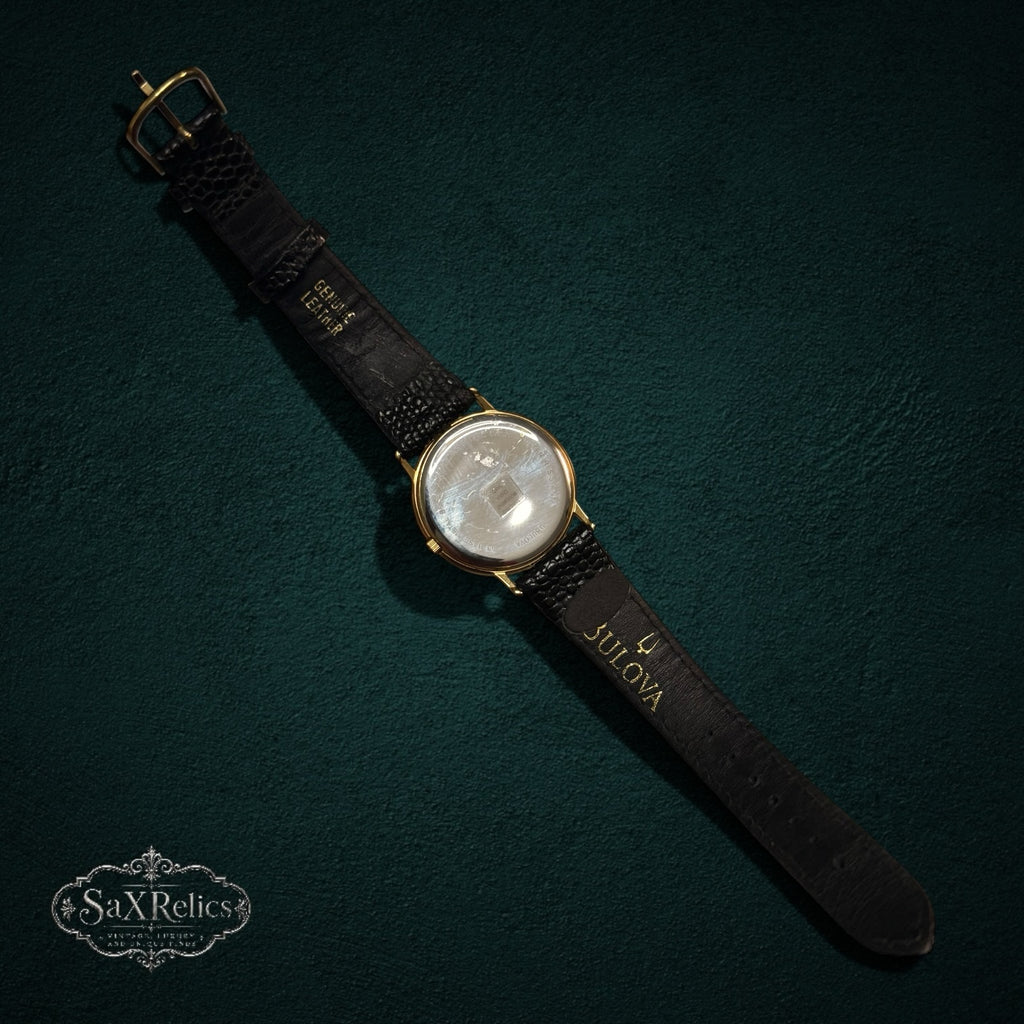 SaX Relics vintage Bulova watch detail showing the Raytheon plaque on the black leather strap