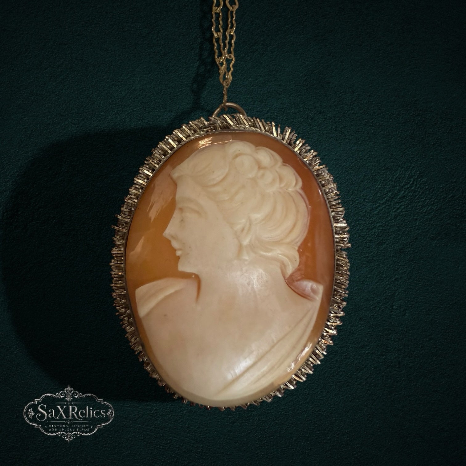 SaX Relics vintage carved shell cameo pendant necklace with a cream profile in a textured gold-tone frame