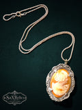 My Store vintage cameo pendant necklace with a peach shell profile in an ornate sterling silver filigree setting