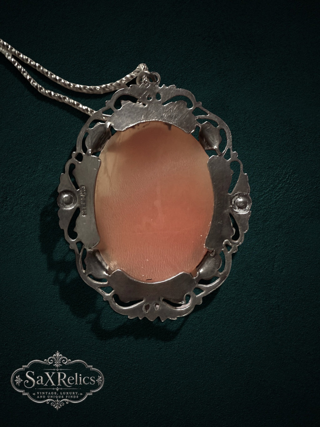 My Store vintage cameo pendant necklace featuring a peach shell cameo in an ornate sterling silver filigree setting.
