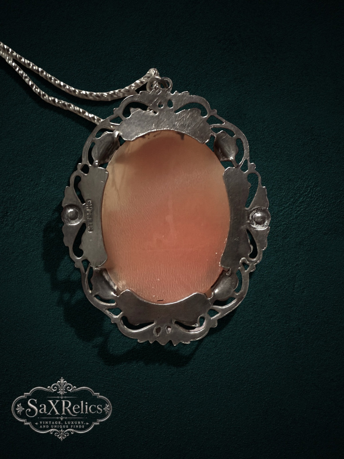 My Store vintage cameo pendant necklace featuring a peach shell cameo in an ornate sterling silver filigree setting.