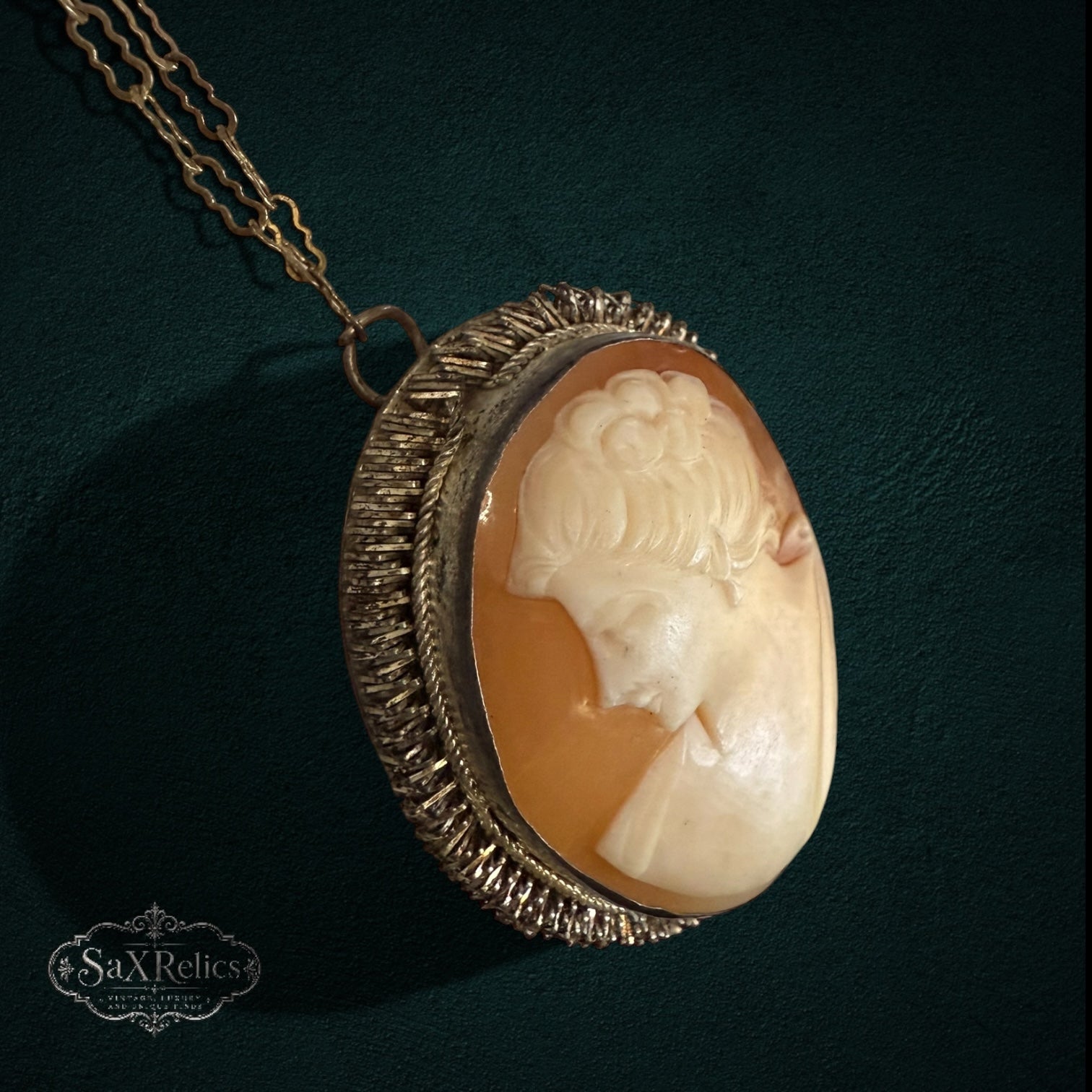SaX Relics vintage shell cameo pendant showing the textured gold-tone frame in detail