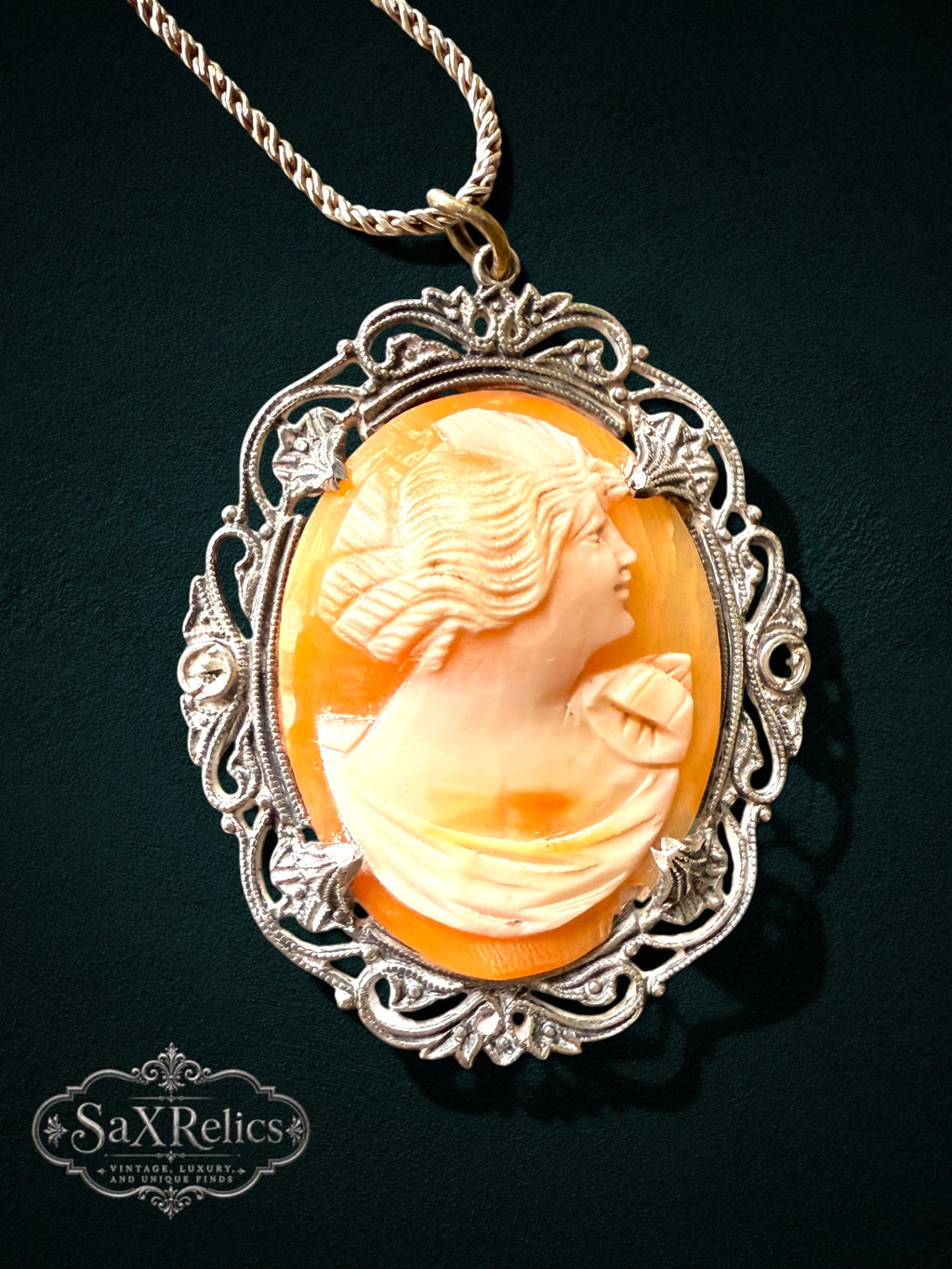 My Store vintage cameo pendant necklace featuring a peach shell profile in an ornate sterling silver filigree setting