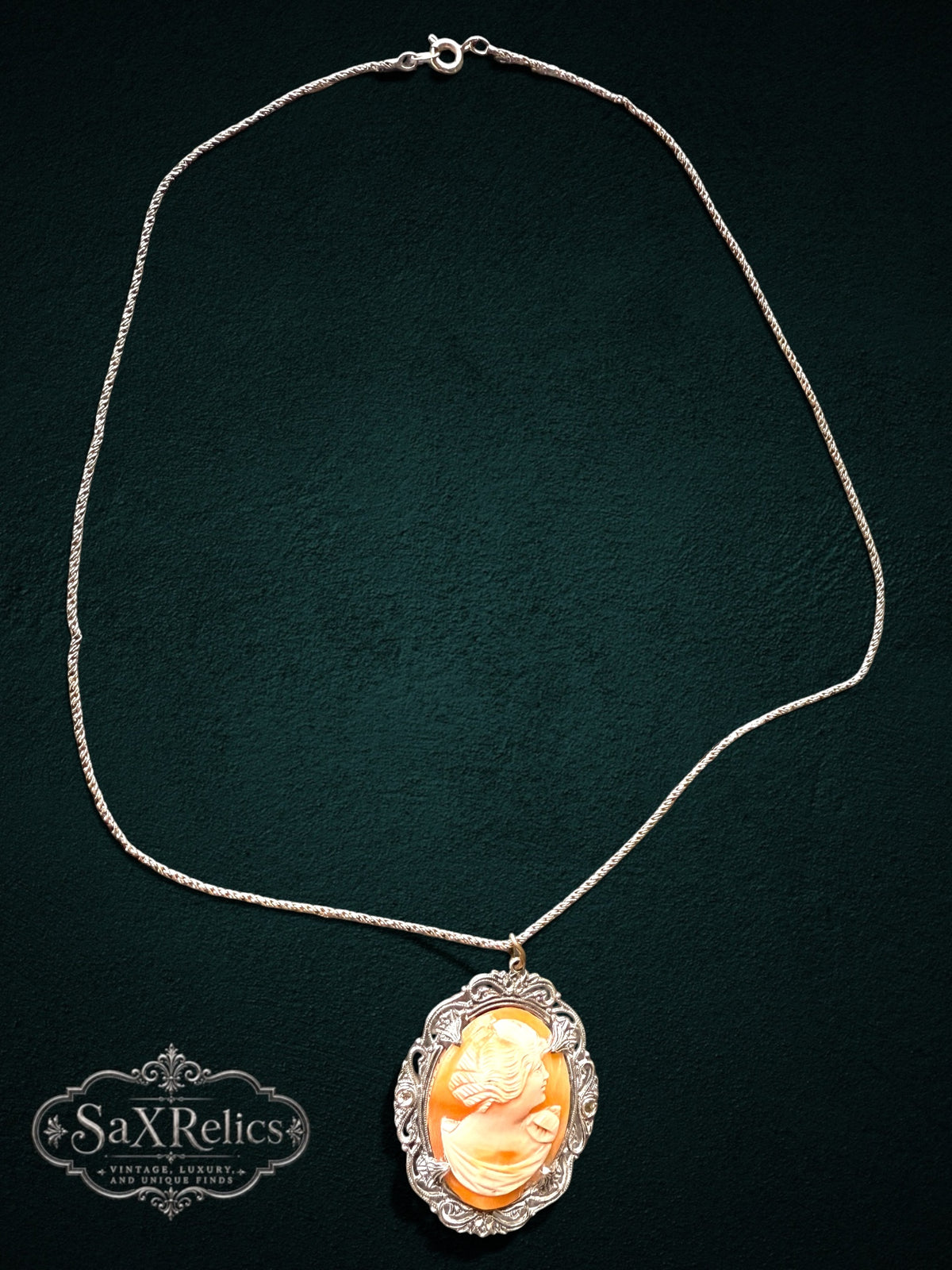 My Store vintage cameo pendant necklace featuring a peach shell profile in an ornate sterling silver filigree setting