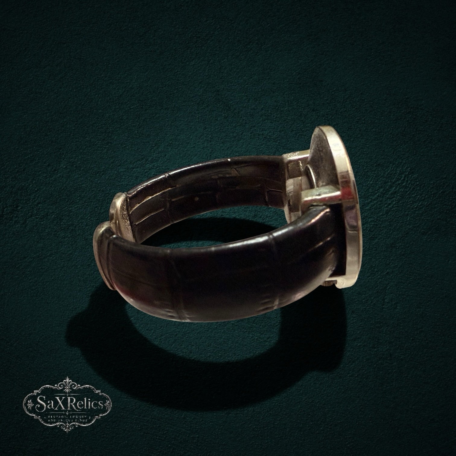 SaX Relics vintage cuff watch showing the open band and silver-tone dial