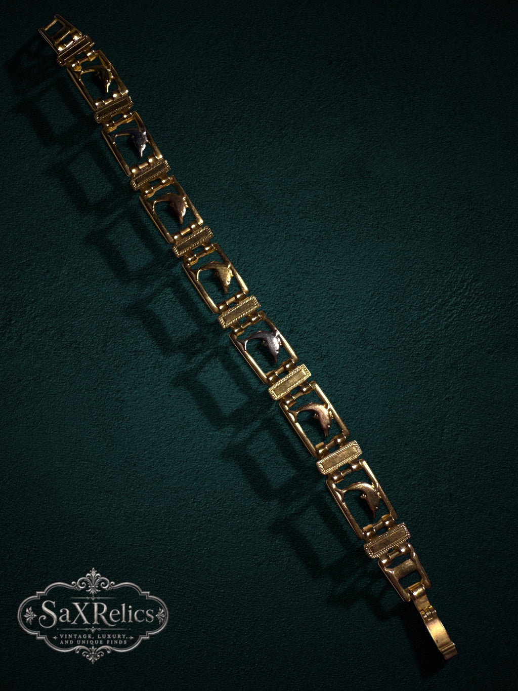 My Store vintage gold-tone link bracelet featuring articulated leaping dolphin motifs in rectangular frames