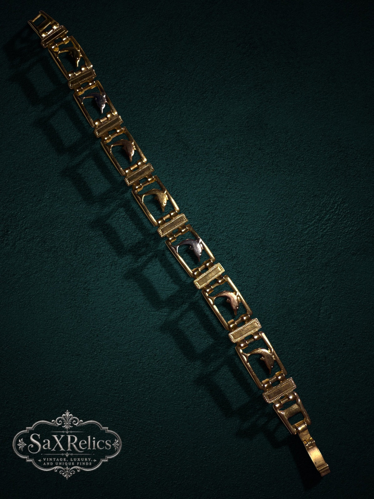 My Store vintage gold-tone link bracelet featuring articulated leaping dolphin motifs in rectangular frames