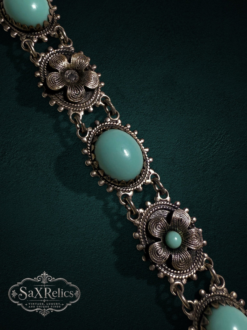 Vintage style floral link bracelet with turquoise cabochons and aged silver-tone filigree metalwork