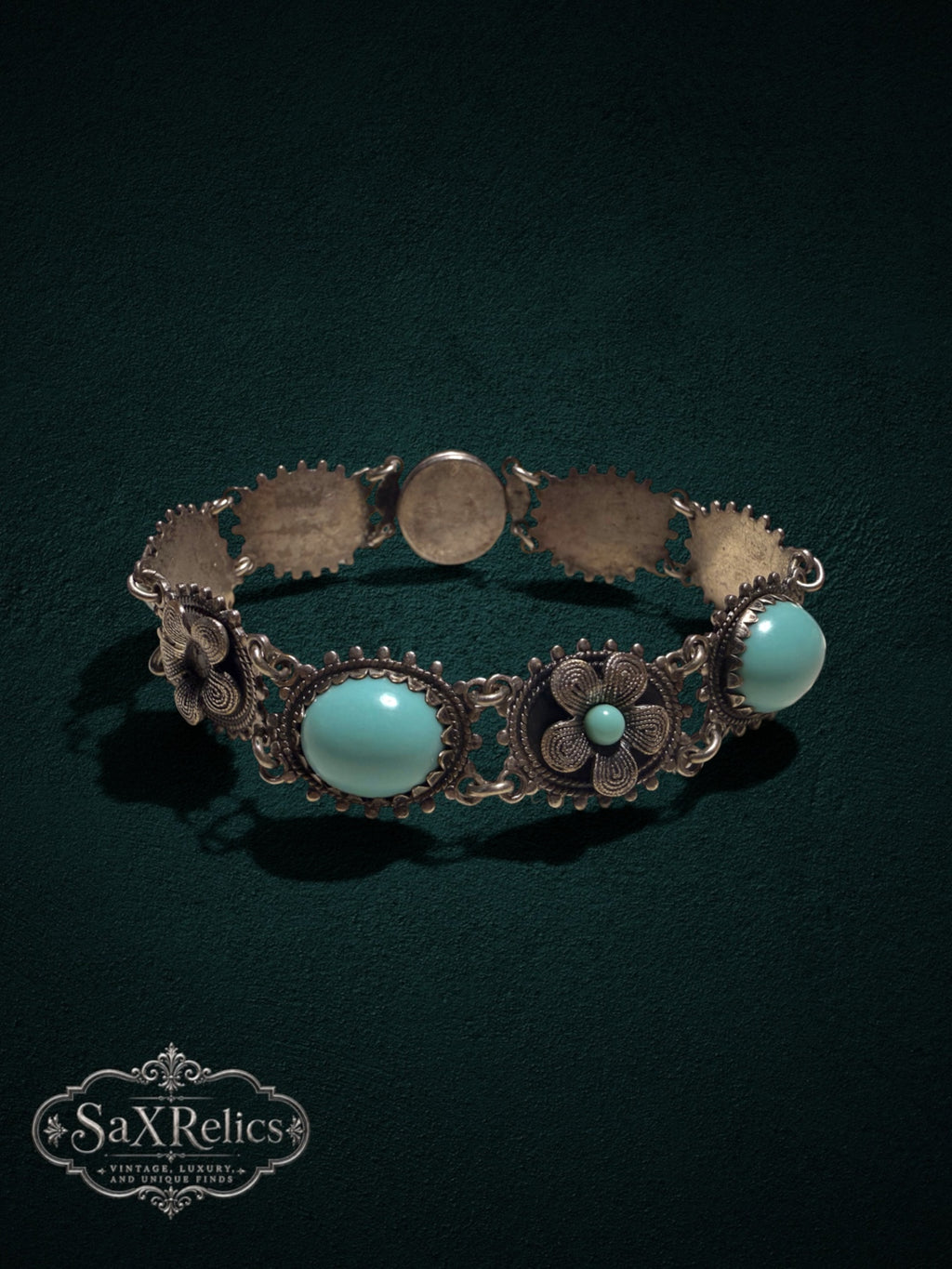 Vintage style floral link bracelet with turquoise cabochons and aged silver-tone filigree metalwork