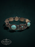 Vintage style floral link bracelet with turquoise cabochons and aged silver-tone filigree metalwork