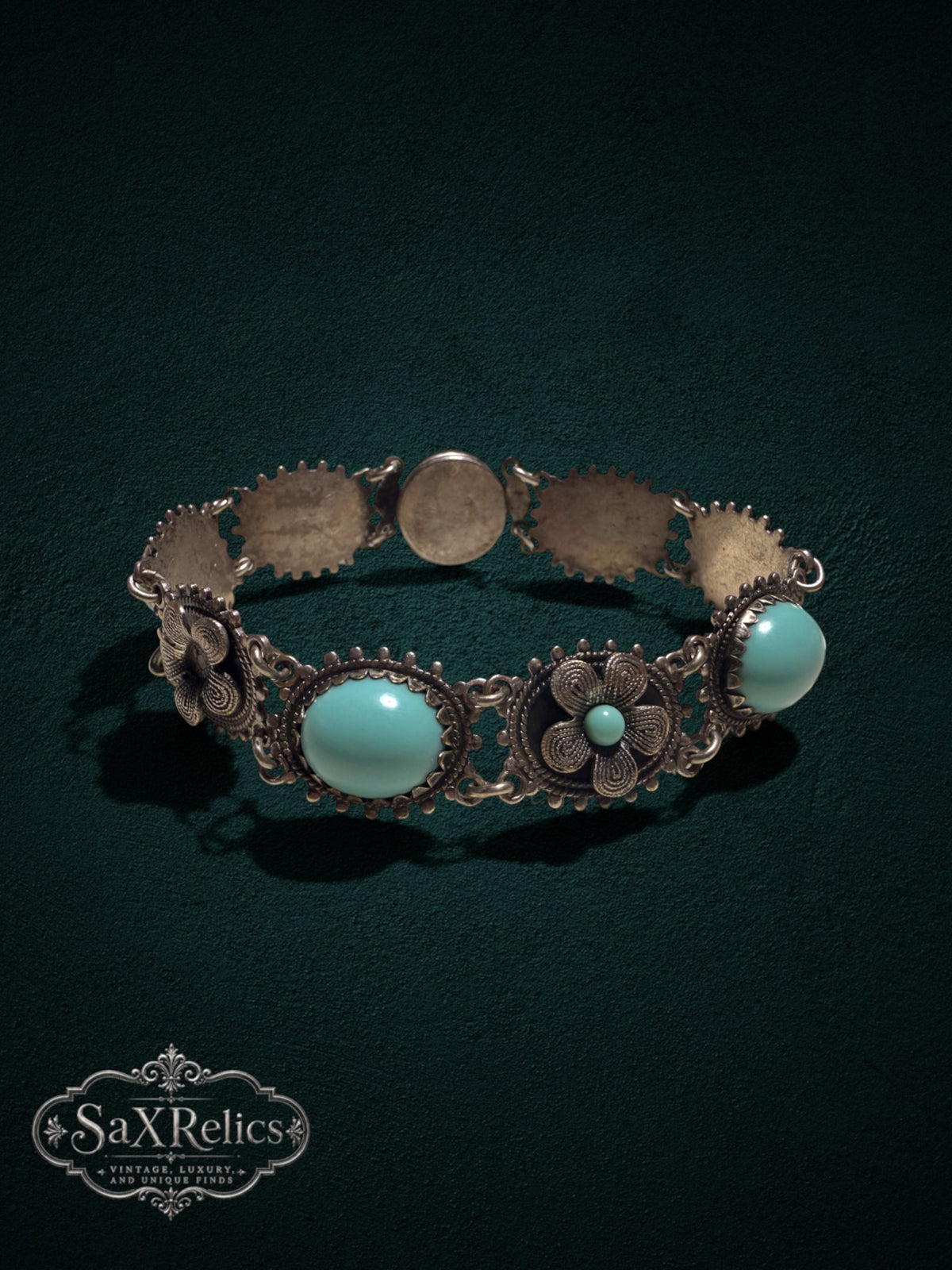 Vintage style floral link bracelet with turquoise cabochons and aged silver-tone filigree metalwork